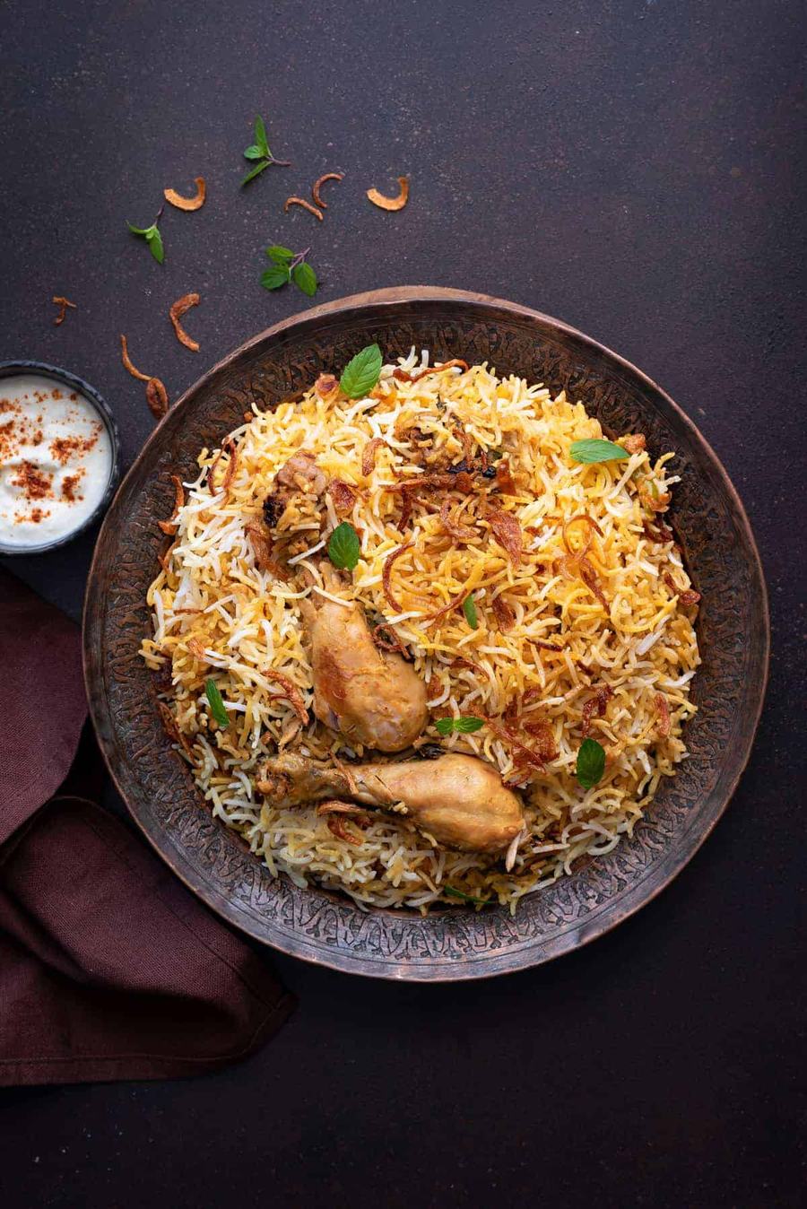 Chicken biryani with saffron basmati rice and raita